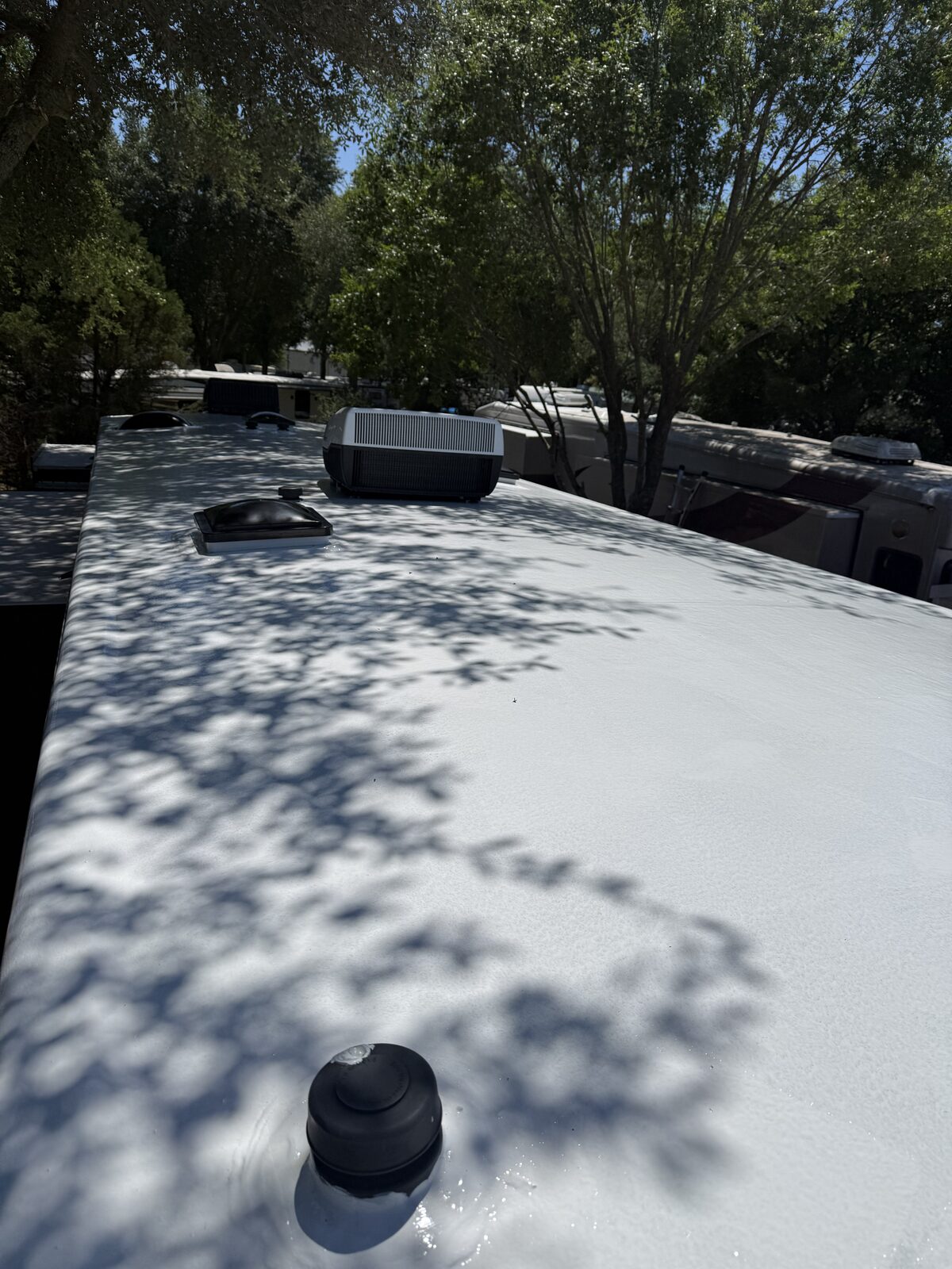 Freshly coated RV roof membrane after full reseal