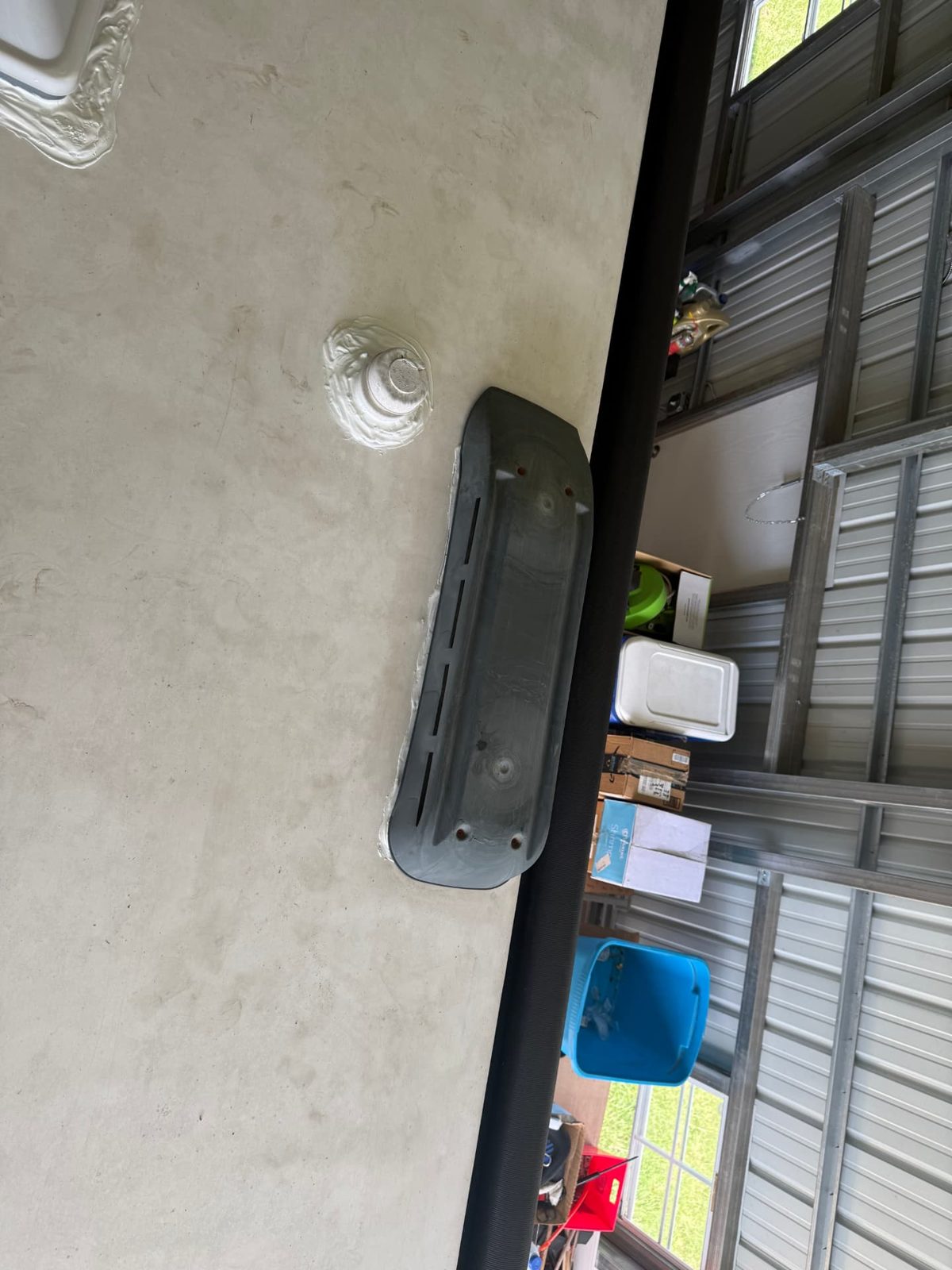 RV sidewall refrigerator vent and plumbing vent resealed with fresh sealant