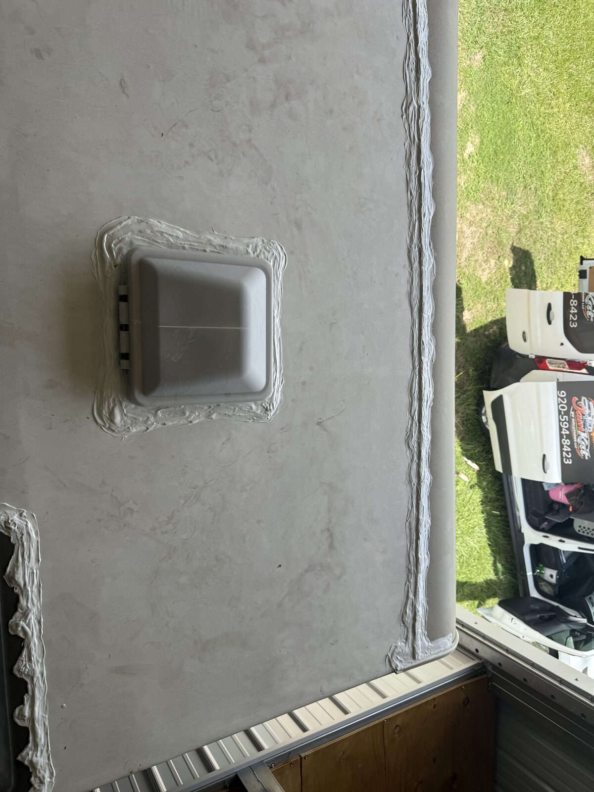 Sidewall vent and outlet resealed on an RV exterior